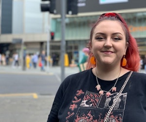 Picture of a student smiling in front of the Victoria Centre