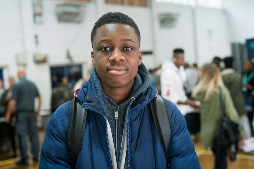 person smiling at a college event