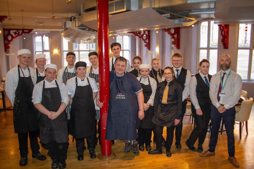 Johnny Pusztai with the students at Adams Restaurant