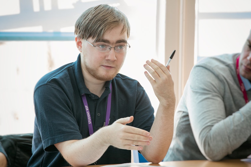 Student rep talking in a meeting
